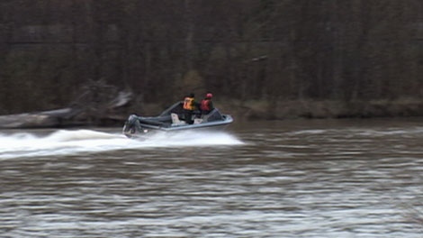 Search crews scour Willow River for a missing passenger from a boat that capsized Sunday afternoon. May 7, 2012. (CTV)