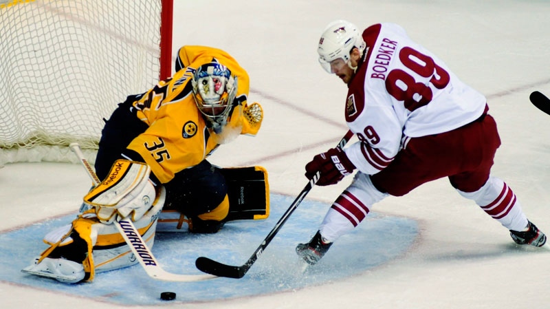 Nashville Predators goalie Pekka Rinne (35), of Finland, stops the shot of Phoenix Coyotes right wing Mikkel Boedker (89), of Denmark, in the first period of Game 4 in an NHL hockey Stanley Cup Western Conference semifinal playoff series, Friday, May 4, 2012, in Nashville, Tenn. (AP / Mike Strasinger)