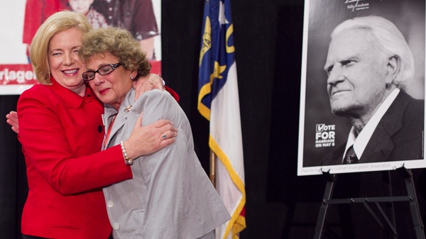 Mary Frances Forrester, the wife of the late N.C. State Sen. James Forrester, right, embraces Tami Fitzgerald from Vote For Marriage NC as they celebrate the passage of Amendment One during an election night party Tuesday May 8, 2012 in Raleigh, N.C. (AP Photo/The News & Observer, Robert Willett) 