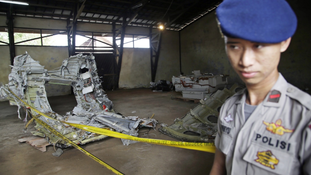 Police guard wreckage from AirAsia Flight 8501