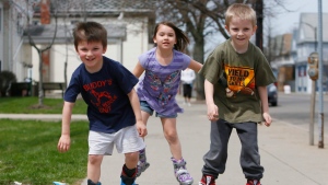 Kids getting fresh air, sunshine and exercise. From left, Allen Armstrong, 4, Hannah Armstrong, 6, and Brian Kuhn, 7, speed down the sidewalk on Tonawanda Street in Buffalo, N.Y., on inline skates, Tuesday afternoon, April 23, 2013. (AP / The Buffalo News, Derek Gee) 
