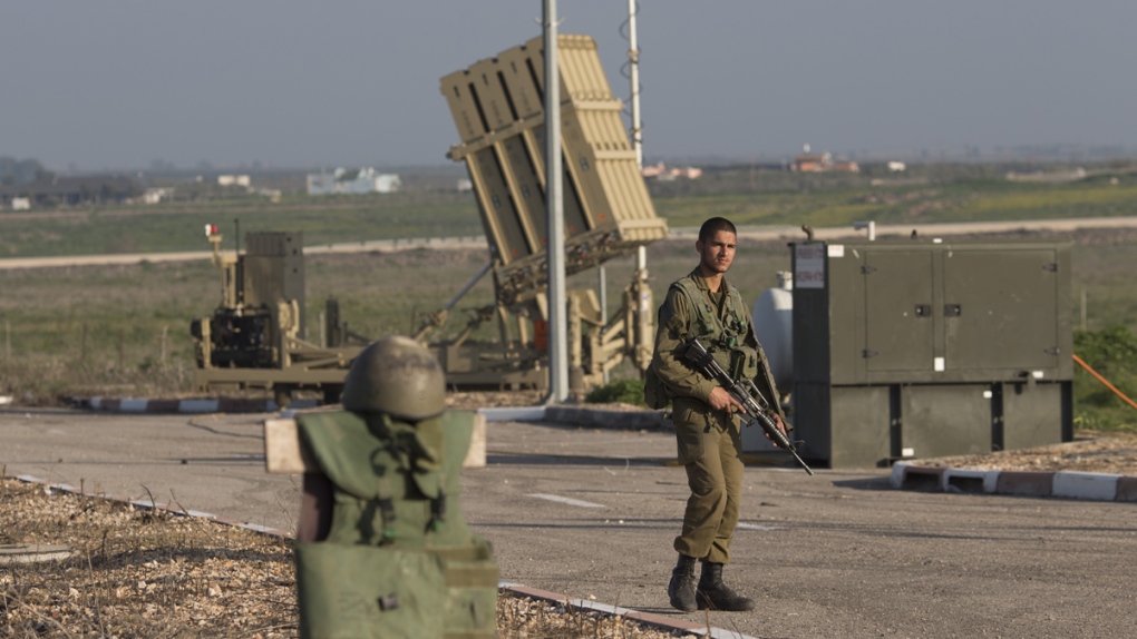 Israeli soldiers patrol at border with Syria