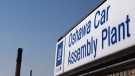 In this Monday, Sept. 17, 2012, file photo, a sign stands outside Oshawa's General Motors car assembly plant in Oshawa, Ont. (AP Photo/The Canadian Press, Michelle Siu)