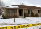 Police tape surrounds a home after a fatal fire in Mt. Brydges, Ont. on Friday, Jan. 23, 2015. (Bryan Bicknell / CTV London)