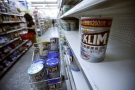 In a protective measure, 'Klim' milk powders produced in China by the Switzerland-based Nestle are taken from shelves at a local grocery store in Taipei, Taiwan, Thursday, Oct. 2, 2008. (AP / Wally Santana)