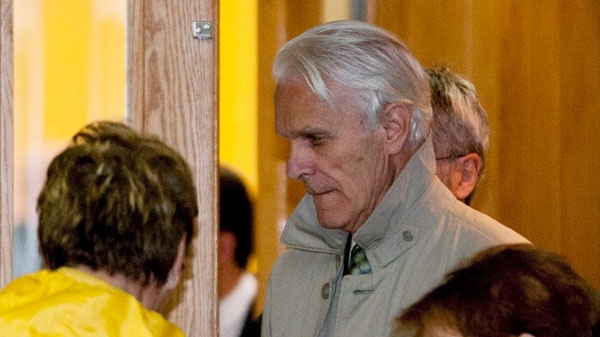 Former judge Jacques Delisle walks out of a courtroom at his murder trial in Quebec City, Tuesday, May 8, 2012. (Jacques Boissinot / THE CANADIAN PRESS)