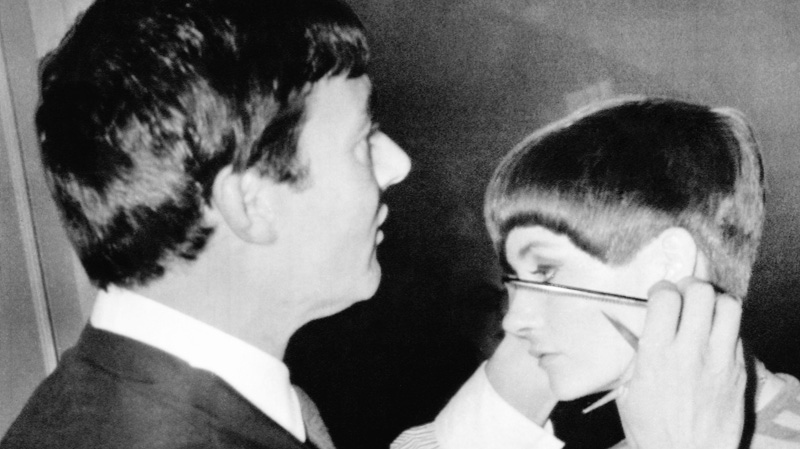 Hair stylist Vidal Sassoon gives New York model Holly McGuire a close-cropped hairdo at a preview of the New York Couture Group styles in New York on Jan. 11, 1966. (AP)