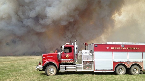 Crews worked Sunday to contain a wildfire burning north west of Grassland, Alta. Photo by: Curtis Chamzuk. May 13.
