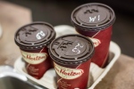 Cups of coffee sit on a counter in a Tim Hortons outlet in Oakville, Ont., on Monday, Sept. 16, 2013. (Chris Young / THE CANADIAN PRESS)