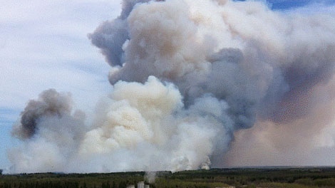 Crews are working to contain a wildfire burning north west of Grassland, Alta. May 13.