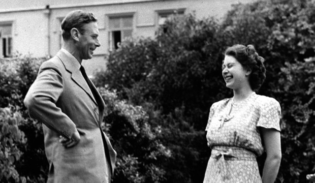 Britain's Queen Elizabeth II, then Princess Elizabeth, right, enjoys a joke with her father King George VI, in the grounds of the Royal Lodge, Windsor, England, in this Aug. 20, 1946 file photo. The Queen will celebrate her 80th birthday on April 21, 2006. (AP Photo)