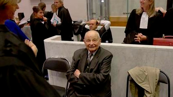 Jacques Servier, center, founder of Servier Laboratories, sits with his lawyers during the opening of the trial at Nanterre's court house, outside Paris, Monday, May 14, 2012. (AP Photo/Michel Euler)