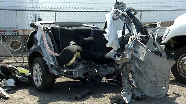 The remains of a 2012 Mitsubishi is seen following a fatal crash in North Dumfries Township on Monday, May 15, 2012.