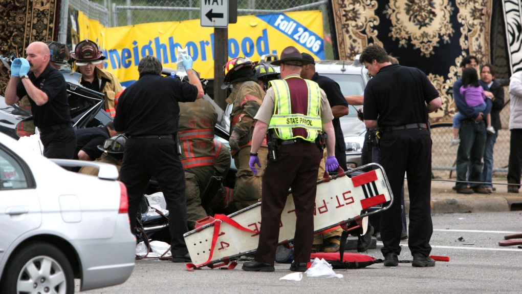 Koua Fong Lee, right, at the scene of the crash