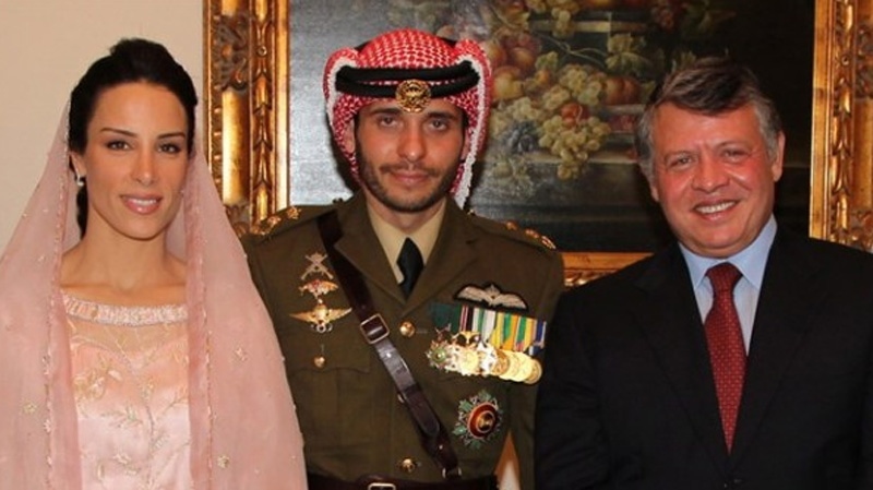 Princess Basmah al Hussein, formerly Basmah Hasan of Stratford, Ont. (left) and groom is Prince Hamzah Al Hussein of Jordan pose Jordan's King Abdullah II in this handout photo. (HO / THE CANADIAN PRESS)