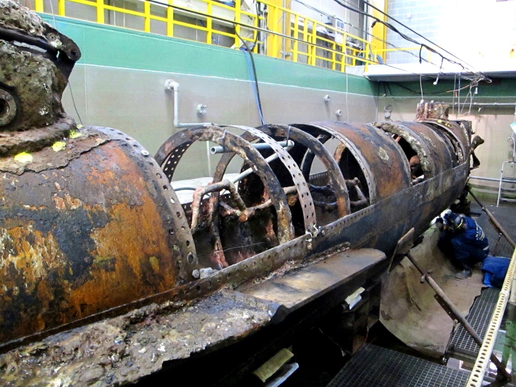 Scientists work to uncover submarine hull