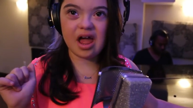 Madison Tevlin, who was born with Down syndrome, recently covered John Legend's hit 'All of Me.' The video was uploaded to YouTube last month, and has since had more than 3.4 million views.(Madison Tevlin/YouTube)

