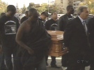 Pallbearers carry the casket of William Junior Appiah, 18, into the church for funeral services on Oct. 6, 2008.