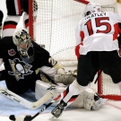 Ottawa Senators Dany Heatley, right, scores a goal behind Pittsburgh Penguins goalie Marc-Andre Fleury, during the second period of an NHL hockey game Sunday Oct. 5 2008 in Stockholm. (AP Photo/Niklas Larsson)
