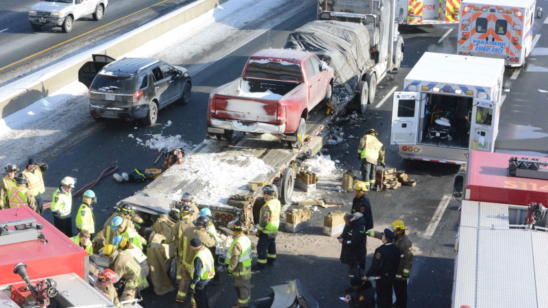 Crews tend to the scene of a crash on Highway 401 in Milton on Tuesday, Feb. 10, 2015. (Andrew Collins / CTV Toronto)