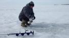 An ice fisher tries his luck on Mitchell's Bay on Feb 13, 2015. (Chris Campbell / CTV Windsor)