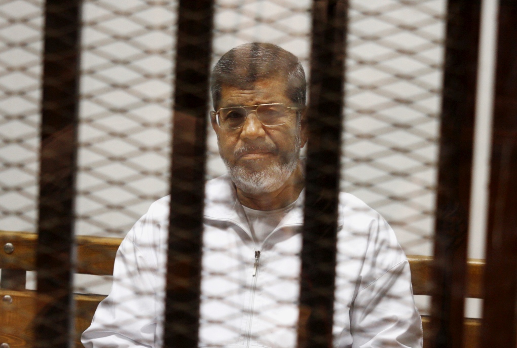 Egypt's Mohammed Morsi in prisoner's box