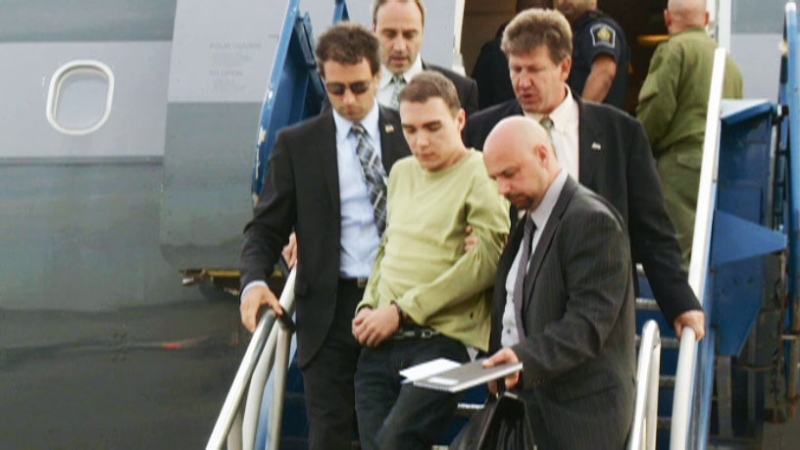 Luka Magnotta is seen arriving off a plane in Quebec, Monday, June 18, 2012.
