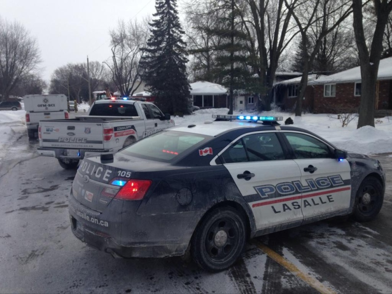 LaSalle police are at the scene of a house fire at 650 Laurier Dr. in LaSalle, Ont., Feb. 16, 2015. (Chris Campbell / CTV Windsor)