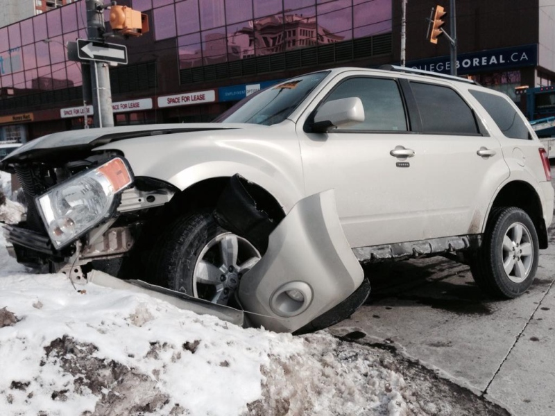 A vehicle sustained front-end damage after a crash at Pelissier Street and Wyandotte Street on Monday, Feb. 16, 2015. ( Michelle Maluske / CTV Windsor)