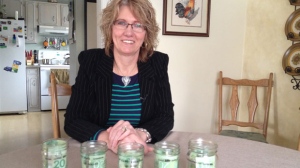 Maria Cadieux budgets her finances with cash stored in these jam jars. Since only spending with cash, she has been able to put $800 towards a loan and has savings in the bank. 