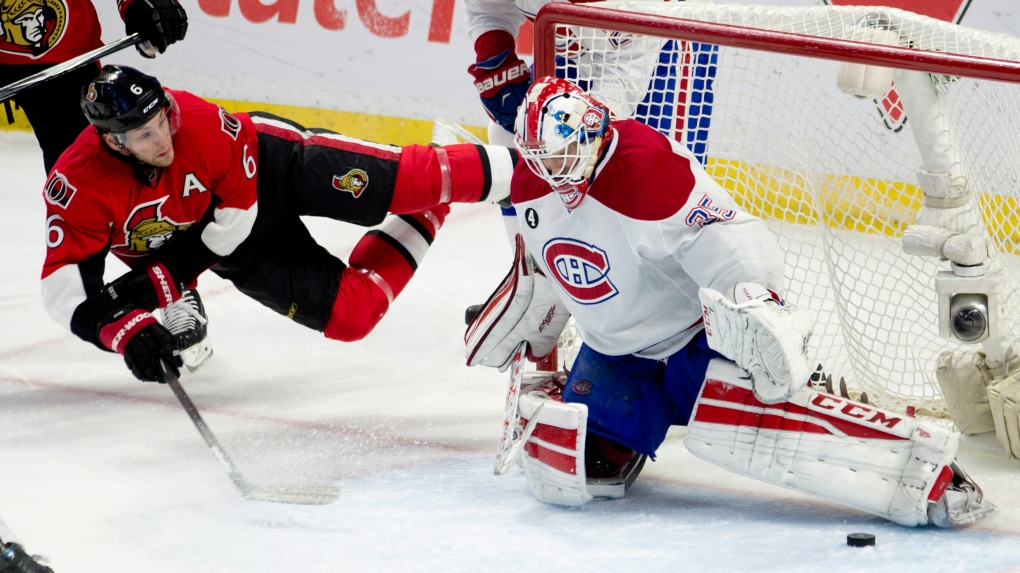 Montreal Canadiens goalie Dustin Tokarski kicks ou