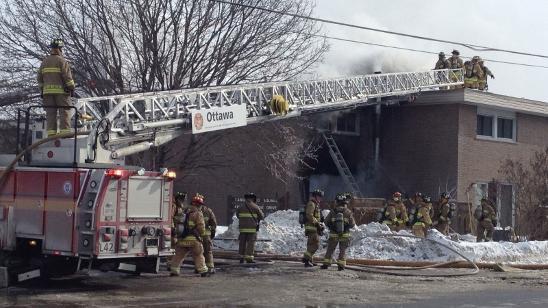Ottawa firefighters battle a serious fire at a two-storey Moodie Dr. row house complex Feb. 19, 2015. (Zane Burtnyk/CTV Viewer)