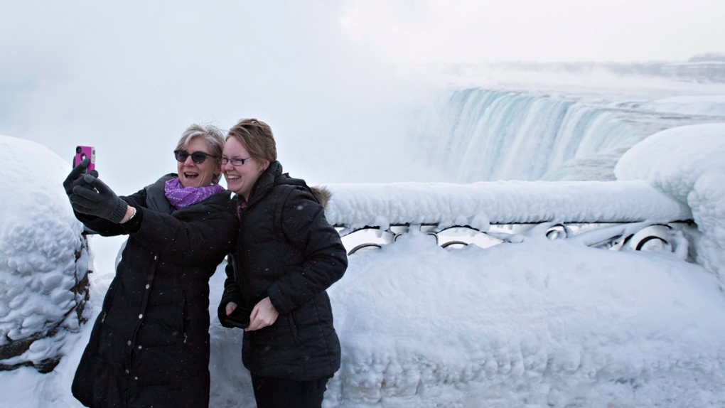 Tourists at the 'Horseshoe' Falls in Niagara Falls
