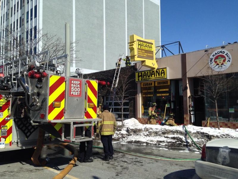 Windsor firefighters are at a fire at a cigar shop on Ouellette Avenue in Windsor, Ont., on Feb. 23, 2015. (Sacha Long / CTV Windsor)