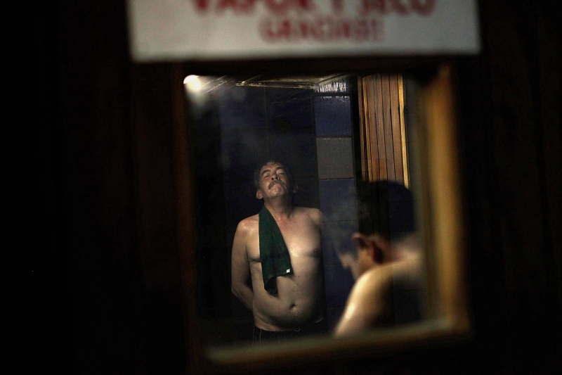 A man takes a deep breath while in the dry room of the Sauna Sucre, one of the oldest in La Paz, Bolivia on Sunday, April 11, 2010. (AP / Dado Galdieri)