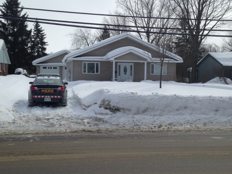 An Orillia OPP cruiser sits outside a home on Fittons Road in Orillia, Ont. where emergency crews say a mail carrier discovered a body on Monday, Feb. 23, 2015. (Rob Cooper/ CTV Barrie)
