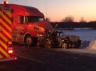 A crash between a car and a transport truck on Manning Road at Baseline Road on Feb. 23, 2015. (Rich Garton / CTV Windsor)