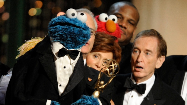 Bob McGrath, right, looks at the Cookie Monster as they accept the Lifetime Achievement Award for 'Sesame Street' at the Daytime Emmy Awards on Sunday Aug. 30, 2009, in Los Angeles. (AP Photo/Chris Pizzello)
