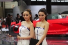 A pair of models pose at the 2011 Shanghai Auto Show (Autofocus)