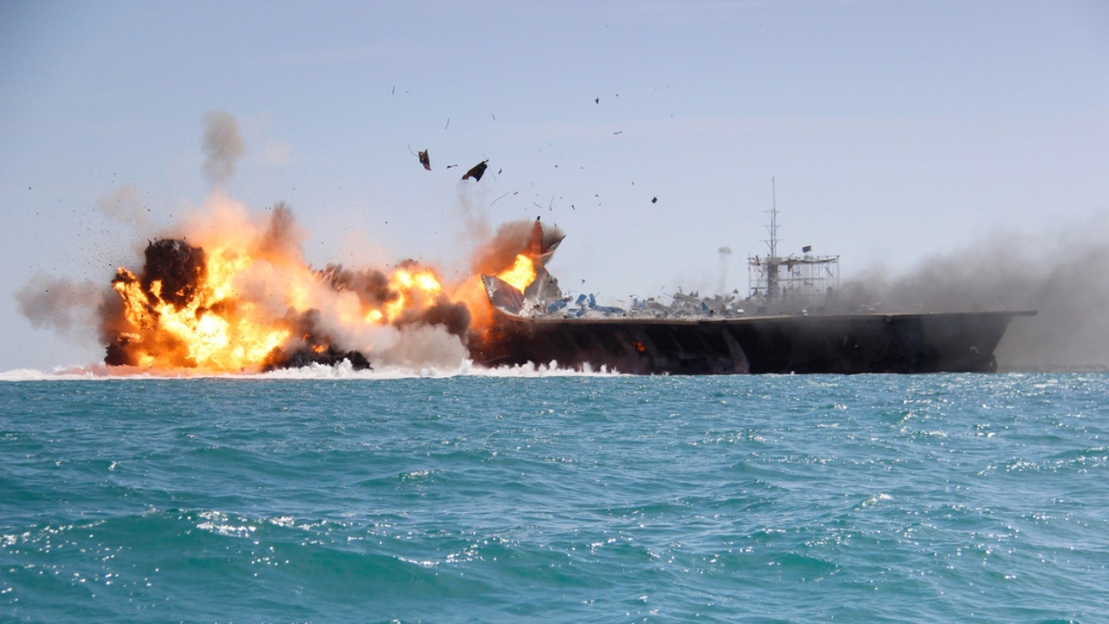 Replica of a U.S. aircraft carrier explodes
