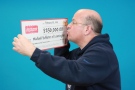 Leamington businessman Michael Schlater claims his Instant Cadillac Riches winnings. (Courtesy of OLG)  