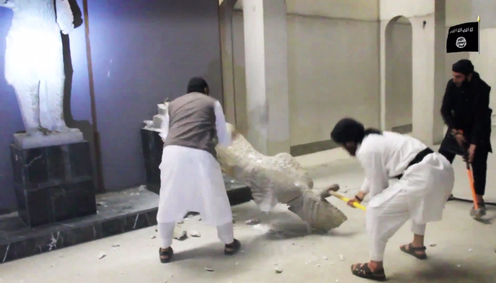 Islamic State group militants smash artifacts