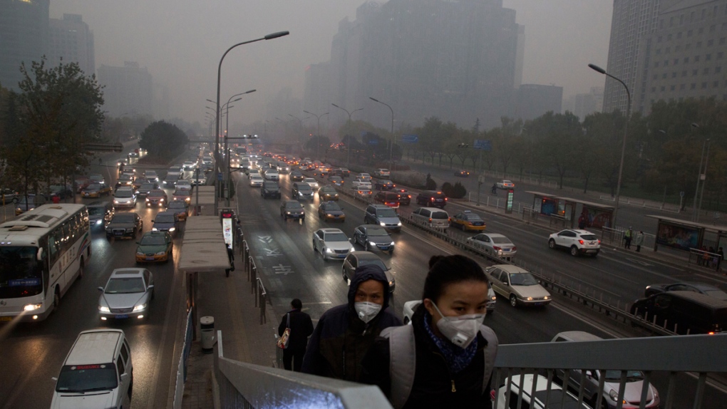 Pedestrians wear masks in Beijing, China