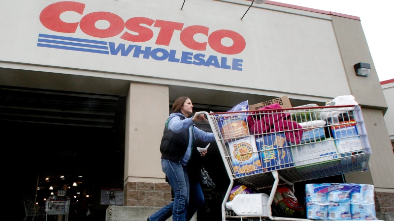 A shopper leaves a Costco store in Portland, Ore., on Dec. 7, 2011. (AP / Rick Bowmer)