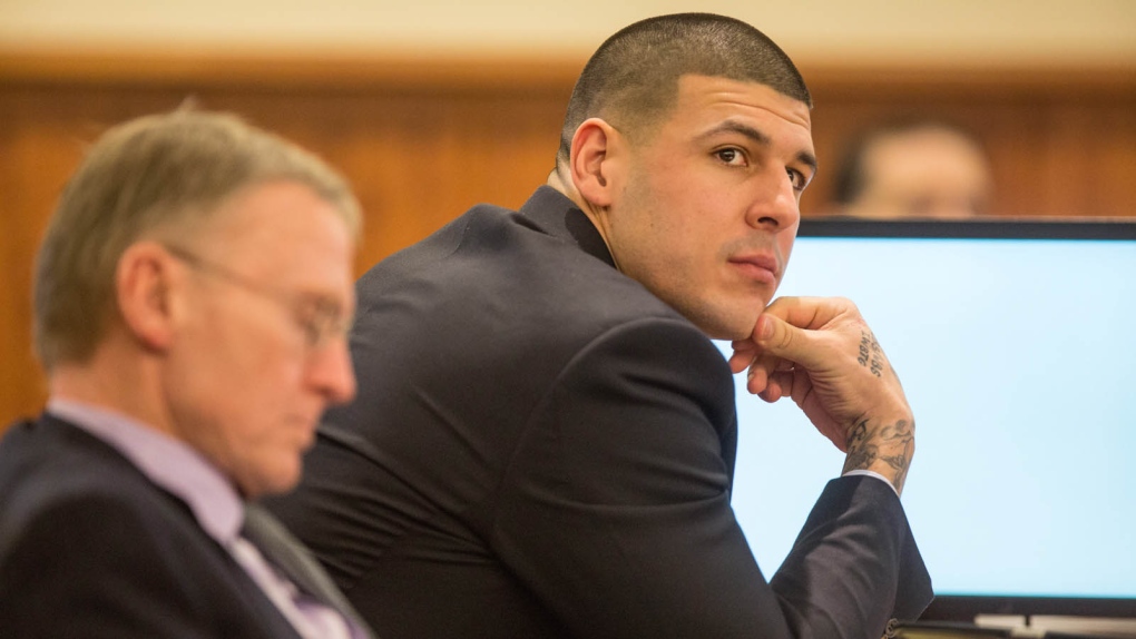 Aaron Hernandez, right, sits with his attorney 