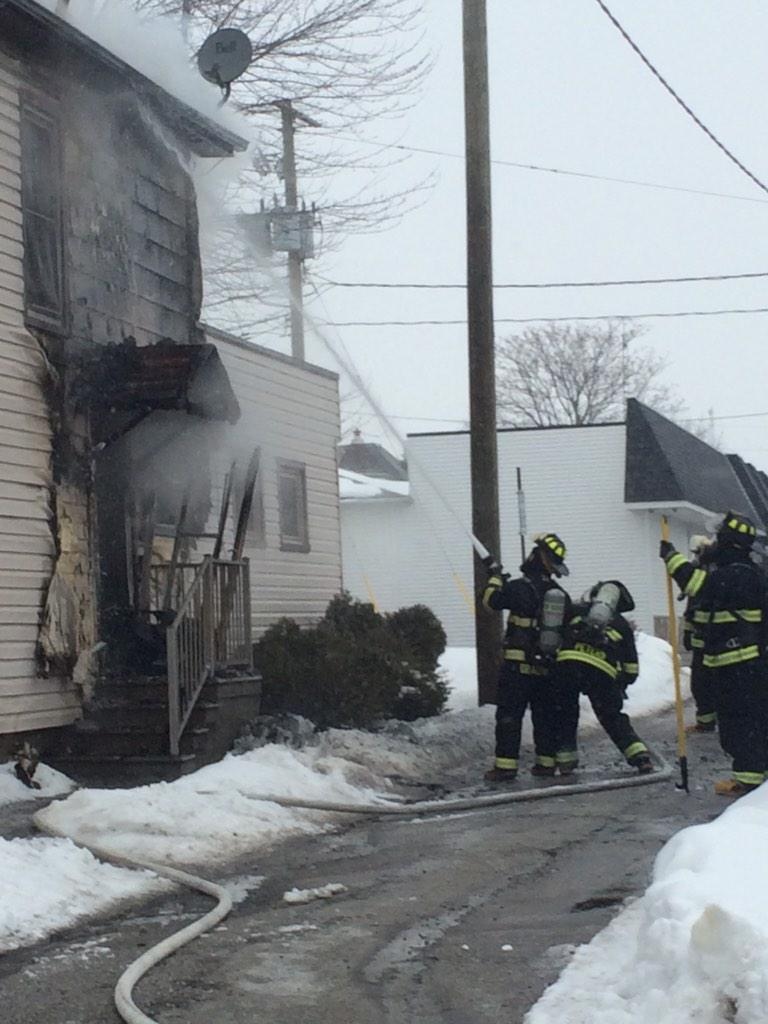 Leamington firefighters are working to put out a fire at a house on Marlborough Street. (Leamington Fire Service/ Twitter)