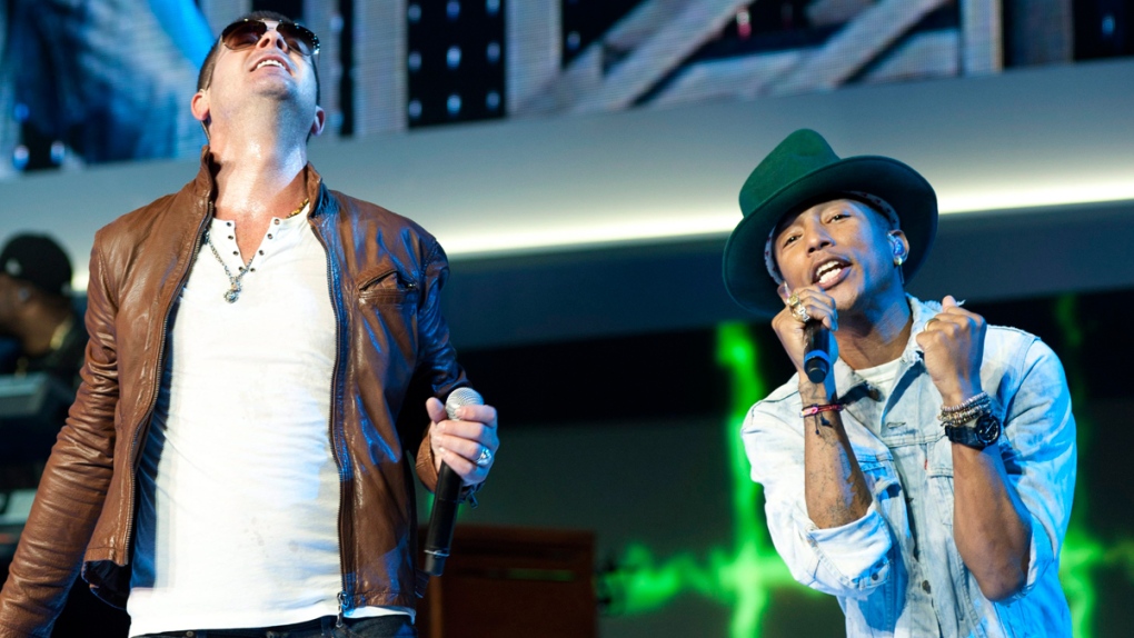 Robin Thicke and Pharrell Williams perform