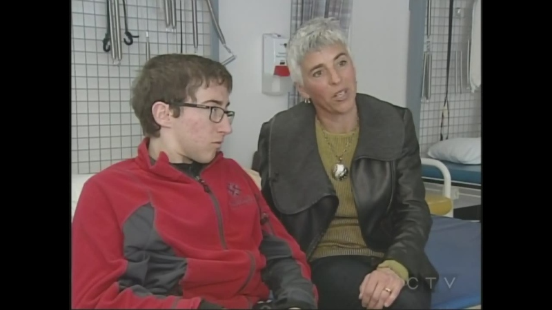 Chris Madden, 21, who is living with spina bifida, and his mother Jacqueline discuss his care in London, Ont. on Friday, March 6, 2015. (Colleen MacDonald /CTV London)