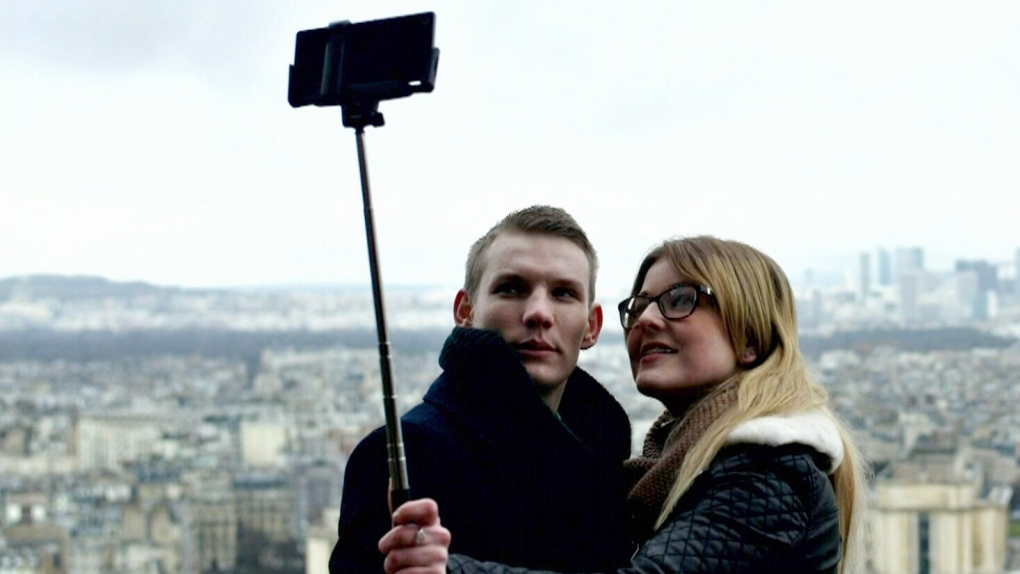 Couple holding selfie stick