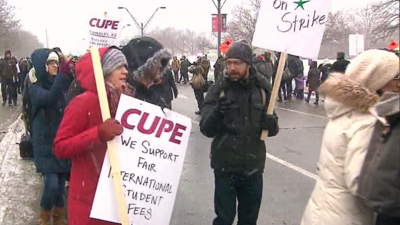 Striking teaching assistants and contract faculty are seen outside York University on Tuesday, March 3, 2015. 